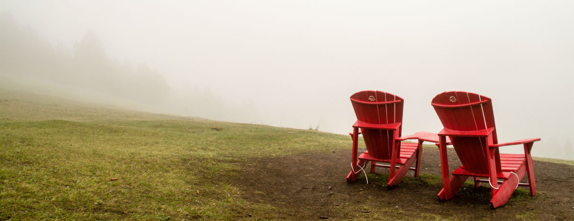 two red chairs in the mist
